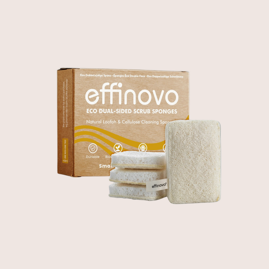 Eco dual-sided loofah and cellulose scrub sponges in front of recyclable packaging