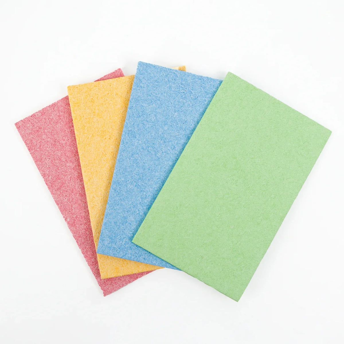 Vier platte EFFINOVO cellulose sponzen in verschillende kleuren